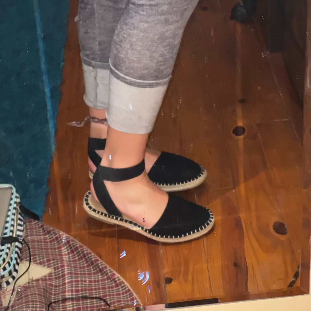 Black strapped sandal.